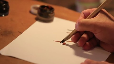 Arabic Caligrapher Write to Paper