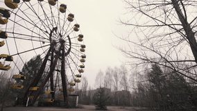 1080p video of an abandoned ferris wheel, pan left, in Chernobyl, Pripyat, The Ukraine