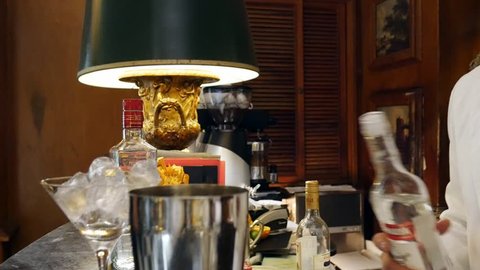 Estoril, Portugal - April 9th, 2019: Bartender prepares a cocktail at the Spies Bar within the Hotel Palacio, frequented by spies during WWII, as well as Ian Fleming, creator of James Bond