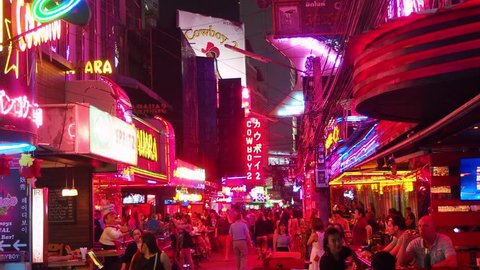Bangkok, Thailand - March 23, 2019:Famous red light district Soi Cowboy in Bangkok with many clubs, bars and prostitutes. The street is a tourist attraction for night life and entertainment. 