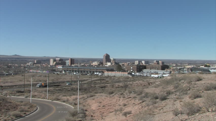 HD Slow zoom into a tight view of the tall buildings in downtown Albuquerque, New Mexico, as seen from the southeast.