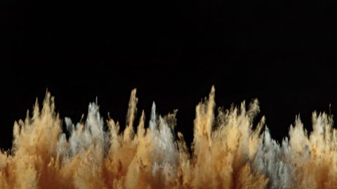 Super Slowmotion Shot of Brown and Silver Powder Explosion Isolated on Black Background.