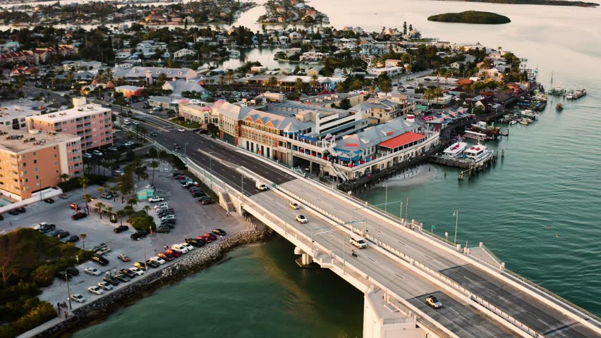 Aerial of Johns Pass Village and Boardwalk at sunset in Madeira Beach Florida