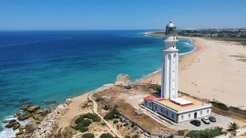 Aerial drone view of the faro de Cabo Trafalgar, a lighthouse at Cape Trafalgar, a headland in the Province of Cadiz in Andalusia, Spain. The 1805 naval Battle of Trafalgar took place off the cape.