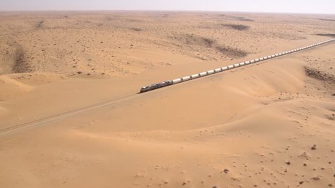 view from the air to a train in the desert of Saudi Arabia. It is the longest train in the world. ( freight train for the aluminum industry- ma'aden aluminium company ras al khair saudi arabia)