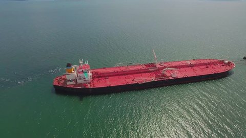 Crude oil tanker sailing on a beautiful day, aerial view

