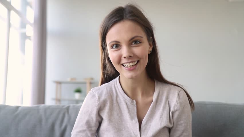 Happy teen girl talking video calling distant friend  chatting laughing having online conversation looking at webcam, cheerful young woman blogger speaking to camera recording vlog
 Royalty-Free Stock Footage #1027488362