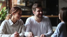 Happy young couple clients customers sign loan investment contract agreement making sale purchase real estate family mortgage deal handshake realtor broker insurer, taking loan, buying insurance - Powered by Shutterstock - Get 15% off with code: PIKWIZARD15