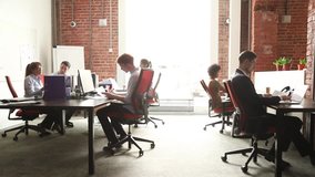 Business people office workers group using pc working talking in big modern coworking space, employees team women men sitting at desks with computers in modern enterprise interior at workplace - Powered by Shutterstock - Get 15% off with code: PIKWIZARD15