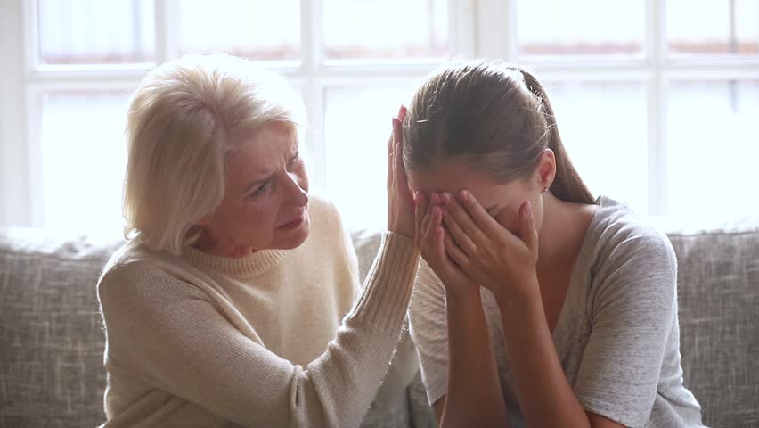 Loving sad old mother sympathizing consoling upset depressed young daughter crying desperate about problem, caring senior mom giving support understanding empathy to stressed adult woman in tears Royalty-Free Stock Footage #1027488479