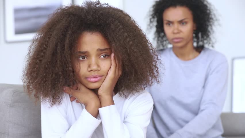 Sad teen african american girl upset by strict mum arguing scolding daughter, stressed stubborn teenager turned back ignoring angry black mother lecturing difficult kid, parent and children conflicts
 Royalty-Free Stock Footage #1027488596