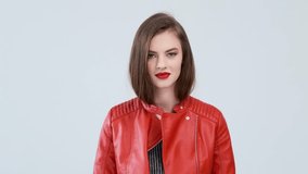 Young surprised girl. The astonished young woman spreads her hands. Beautiful girl with bright emotions. real time footage. 4k video. - Powered by Shutterstock - Get 15% off with code: PIKWIZARD15