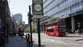 ULEZ, London, UK - April 8 2019: ULEZ (Ultra low emission zone) charge congestion charge  Ultra Low Emission Zone (ULEZ) warning sign central London £12.50, TFL stock footage clip video