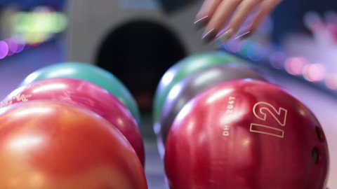 Close-up a group of colored bowling balls in the club