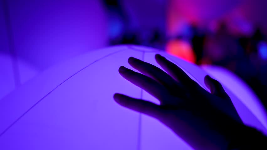 Cinematic Hand Touching Glowing Colorful Ball Changing Colors Bokeh at Mori Digital Art Museum Teamlab Borderless in Tokyo, Odaiba, Japan. Royalty-Free Stock Footage #1027513598