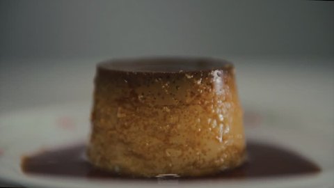 Caramel dripping over a flan. Quesillo is a kind of flan made with eggs, milk and sugar. Very traditional dessert of the Venezuela cuisine. Traditional serve on special occasions  