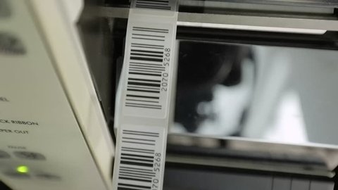 Closeup on barcode enterprise printer when printing barcode labels