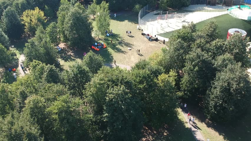 Park Olympic Village or Olimpiyskiye Prudy in Moscow - 2018. Troparyovo-Nikulino and Prospekt Vernadskogo District of Western Administrative Okrug Moscow, Russia. sitting on bean bag chairs while rest
