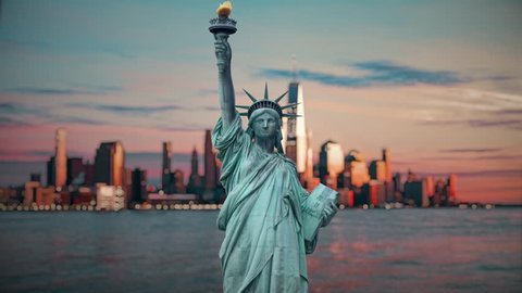 Dramatic view of the statue of the Liberty, with Manhattan in a red sunset background, Cinemagraph 4K
