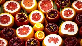 Footage of sliced ripe fruits in street food store.Cut fresh pomegranate,grapefruits and oranges in grand bazaar.Buy delicious exotic fruits in Turkish market