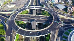 Aerial drone video of multilevel highway junction urban ring crossing road during rush hour