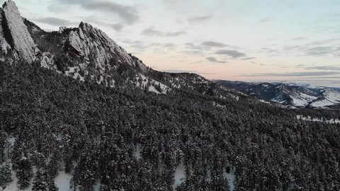 Aerial pan, sunrise at the Flatirons in Colorado, USA
