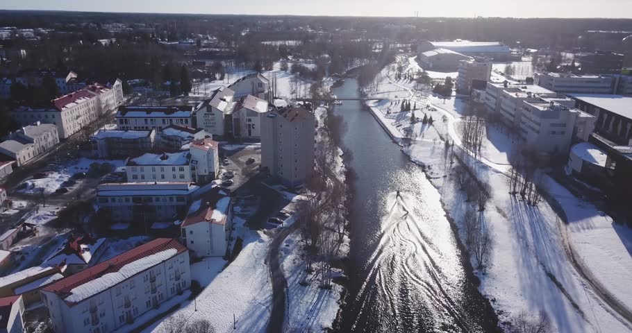 Aerial: Wakeboarding in an icy river in winter, Seinäjoki Finland! Royalty-Free Stock Footage #1027534862