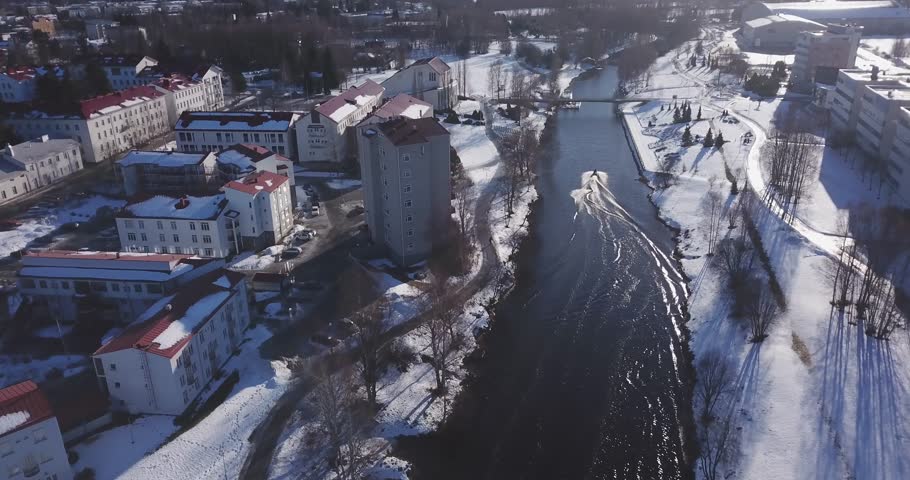 Aerial: Wakeboarding in an icy river in winter, Seinäjoki Finland! Royalty-Free Stock Footage #1027534928