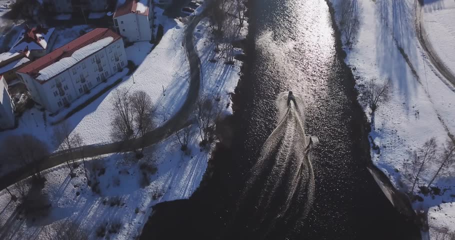 Aerial: Wakeboarding in an icy river in winter, Seinäjoki Finland! Royalty-Free Stock Footage #1027534952