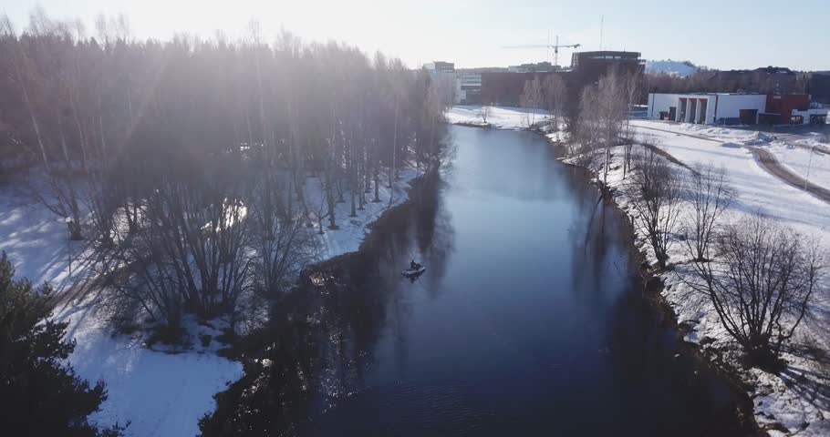 Aerial: Wakeboarding in an icy river in winter, Seinäjoki Finland! Royalty-Free Stock Footage #1027534967