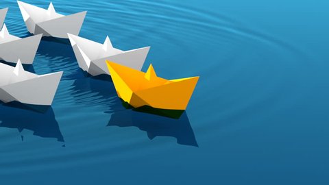 Leadership concept, yellow leader boat with white paper boats floating in the blue waves of the sea