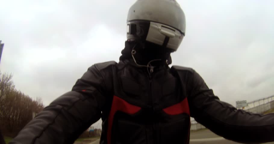 The guy in the helmet rides a sports bike. | Shutterstock HD Video #1027548602