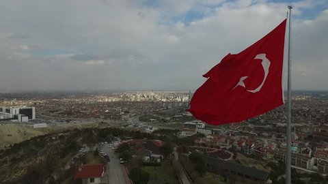 Konya, Turkey, 2 March 2019, Turkish flag and the view from the top of the city in the background