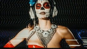 beautiful woman with custom designed candy skull mexican day of the dead face make up. this version has been run through various processes and effects to give it intentional video static and distortio