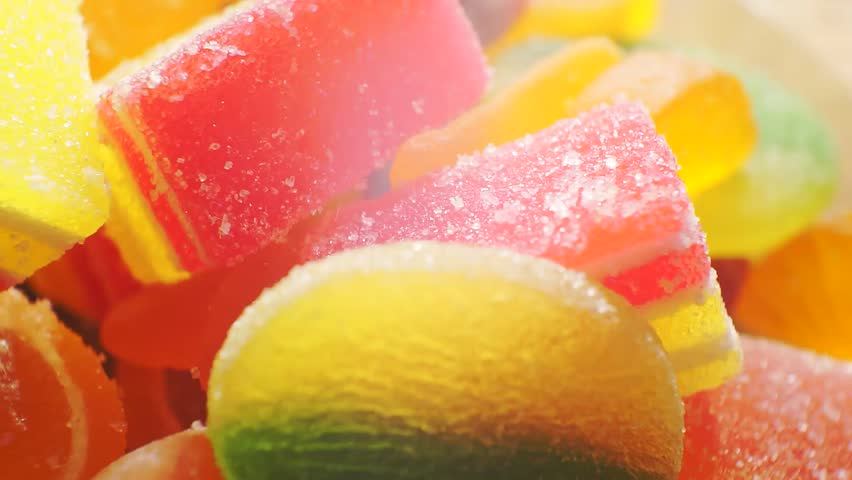 different bright colorful pieces candied fruit jelly (marmalade) close-up.abstract sweets background for your design.macro shoot.shallow depth of field.
