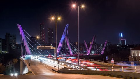 Illuminated Wadi Abdoun bridge at night, Amman, Jordan. Car traffic and light trails. Time lapse video.