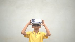 Exciting kids watching virtual reality box on grey white brick background  
