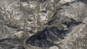 Slow river flowing under the railroad bridge 4K aerial footage