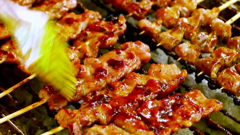 Food Video Satay Pork or Chicken Be prepared with bamboo and grill it on a wood stove or a charcoal oven and a seasoned seasoning at street food Satay is born from Java Island or Sumatra in Indonesia