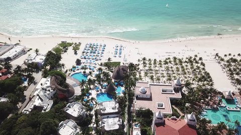 Top view of beautiful beach. Aerial drone shot of turquoise sea water at the beach. Luxury tropical resort with white sand. Aerial view 庫存影片
