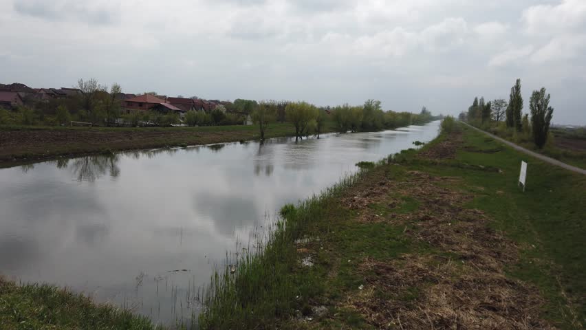 Bega River at Utvin village near Timisoara. River landscape on a cloudy day