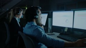 Late at Night In Modern Office: Row of 24/7 Support People and Salesmen Working at their on Desktop Computers, Using Headsets and Making Calls, Talking to Clients and Customers - Powered by Shutterstock - Get 15% off with code: PIKWIZARD15