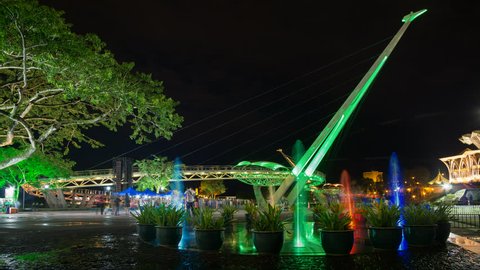Colourful Fountain and Lightshow Near Kuching Waterfront With Iconic Darul Hana Bridge In The Background. Kuching, Sarawak, Malaysia