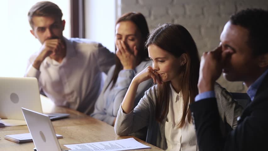 Stressed shocked diverse workers team frustrated about business failure reading discussing bad news results or email online looking at laptop, depressed upset colleagues having problem with computer | Shutterstock HD Video #1027633994