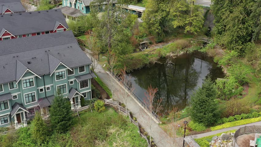 Houses in suburb at Summer in the north America. Luxury houses with nice landscape. Aerial drone view. 4K.