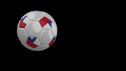 Soccer ball with the flag of Chile flies past the camera, slow motion, 4k footage with alpha channel