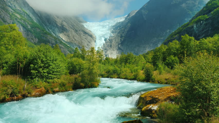 Mountain river and Brixdal glacier in the background. The Incredible Landscapes of Norway Royalty-Free Stock Footage #1027648604