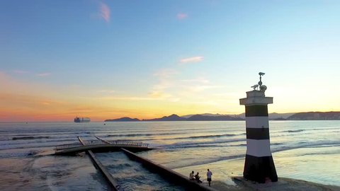 Drone shot Santos Brazil beach lighthouse sunset  
