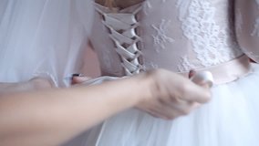 Young woman wearing bridal dress at wedding day. close up