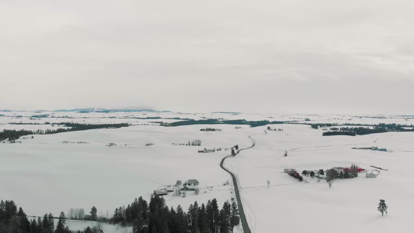 Booming down along Highway 27 in Eastern Washington toward Pullman, over the snow-covered Palouse landscape